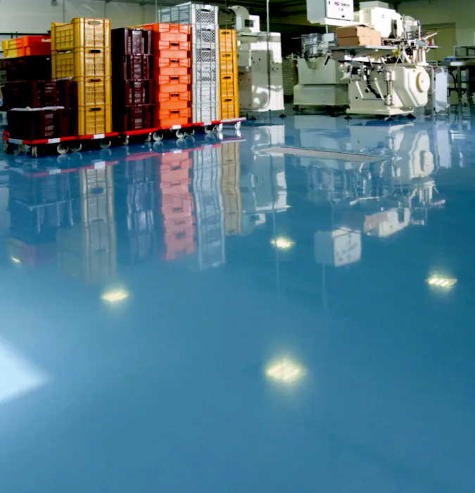 an image of a freshly painted and sealed basement floor, it's a stunning and shiney light blue high gloss