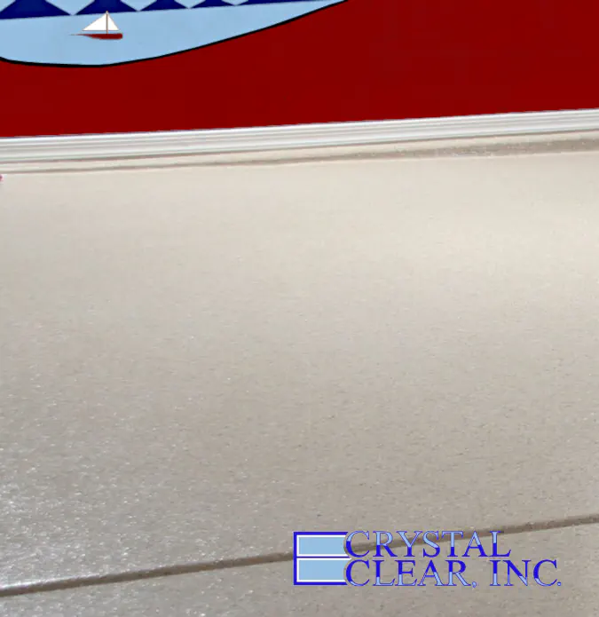 an image of the a garage floor coating job just completed, its an off white lightly textured, it looks very classy
