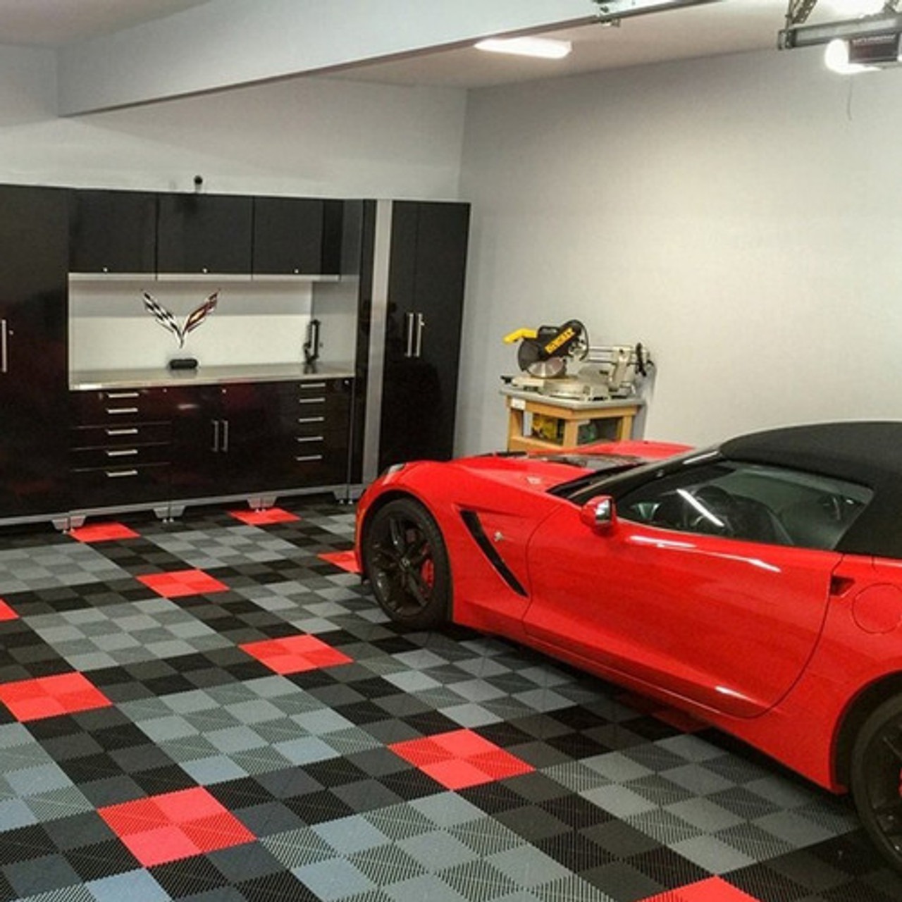 cool image of a dark and light grey racing checker board design garage floor coating with bright bright red trim, looks stunning