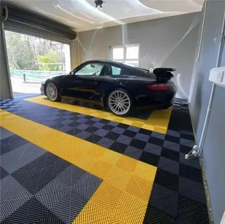cool image of a dark and light grey racing checker board design garage floor coating with bright yellow trim, looks very modern