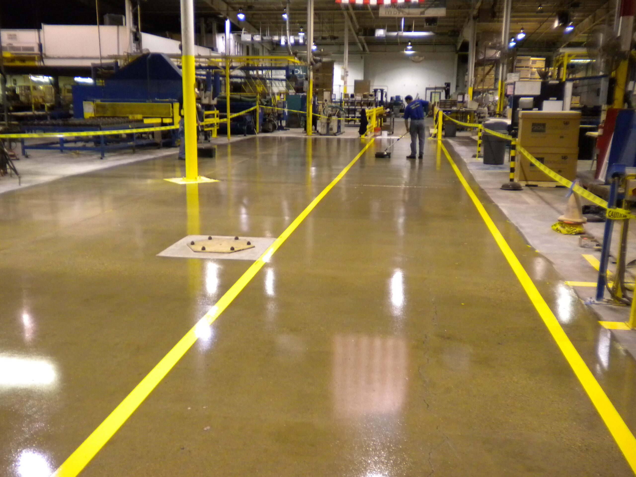 an image of Industrial Floor Services in a warehouse, a newly sealed and painted floor, it looks ckean and sharp